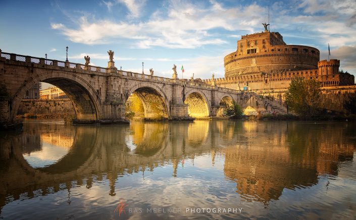 View over the Tiber in Rome with the Ponte Sant'Angelo and Castel Sant'Angelo on a sunny autumn afternoon with warm golden light - Rome, Italy