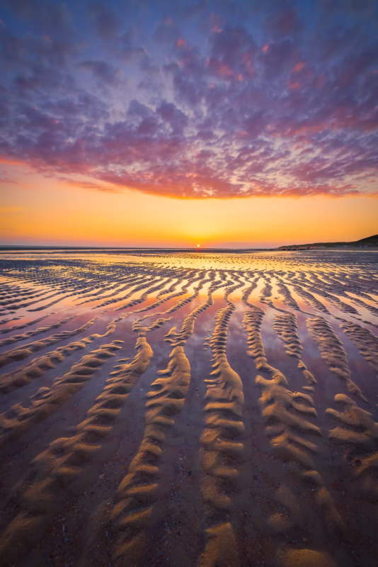 Zonsondergang aan zee bij Burgh-Haamstede